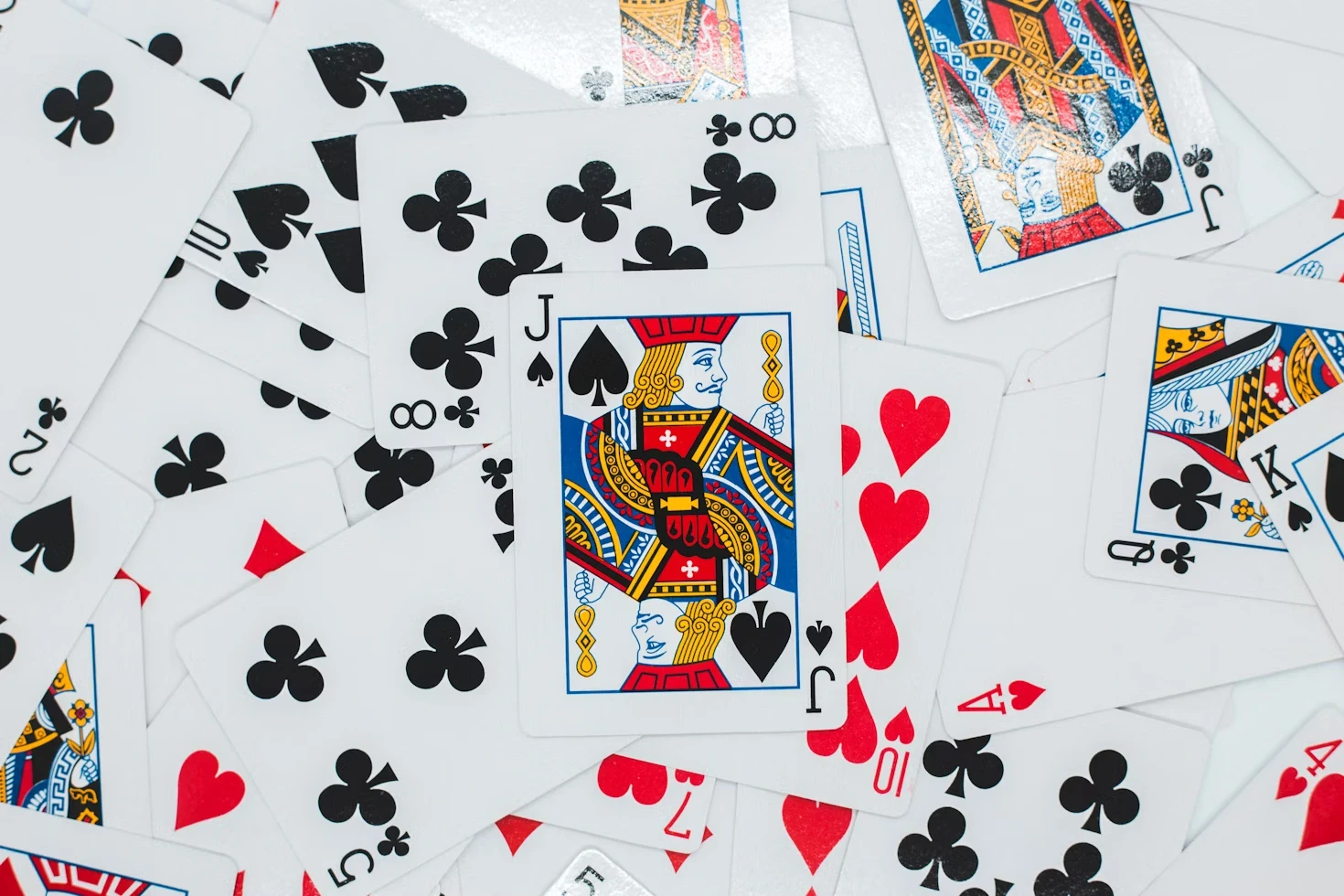 Person holding playing cards